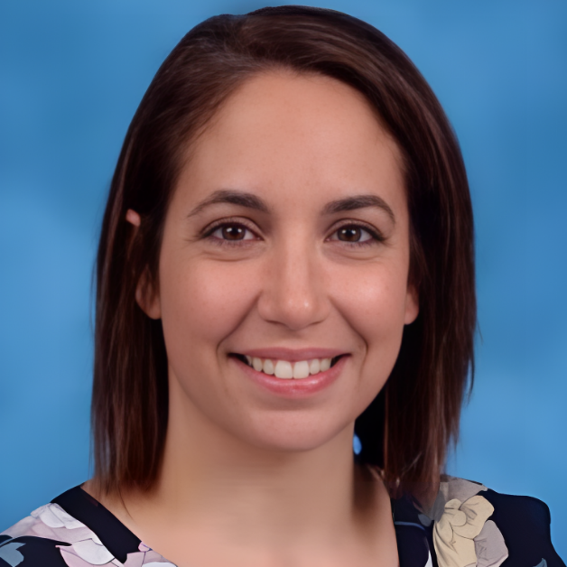 Professional headshot showing an individual smiling