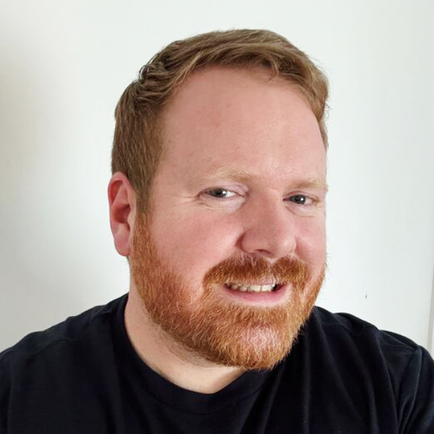 Professional headshot showing an individual smiling