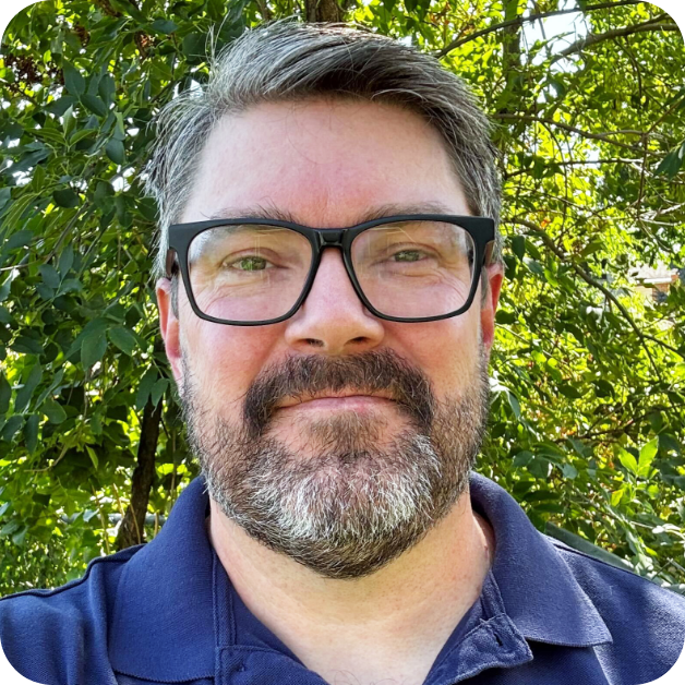 Professional headshot showing an individual smiling