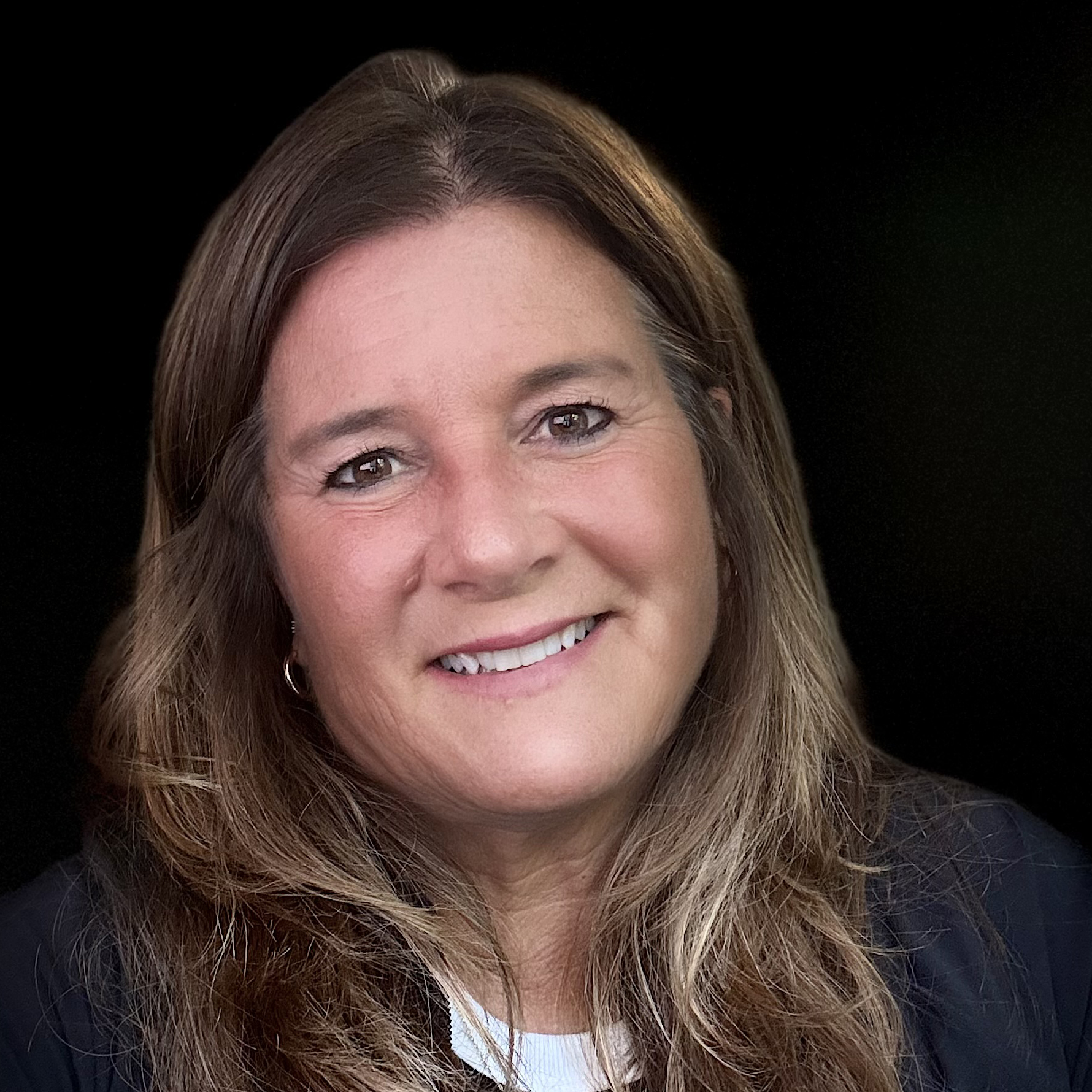 Headshot of a woman with long brown hair.