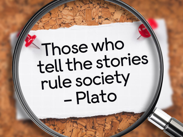 A quote by Plato about storytelling, viewed through magnifying glass.