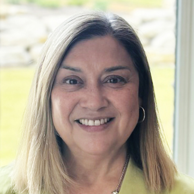 Professional headshot showing an individual smiling