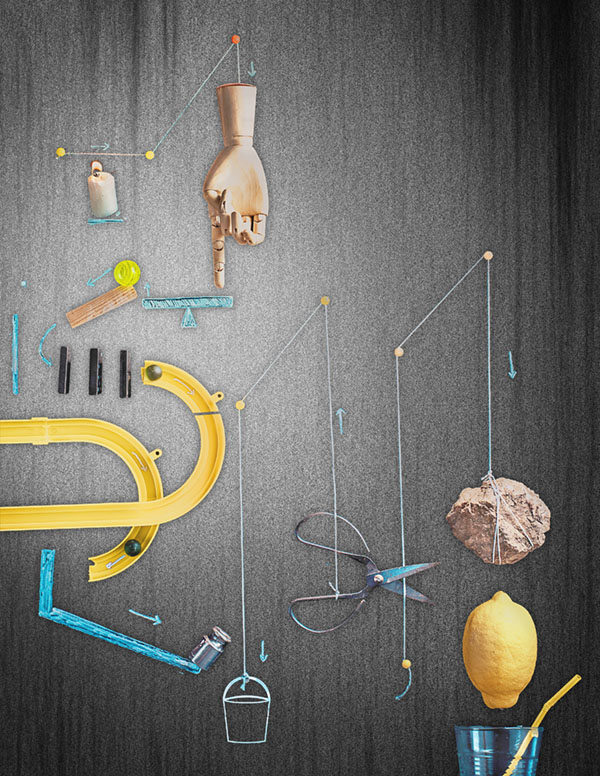 Complex chain reaction machine on dark background.