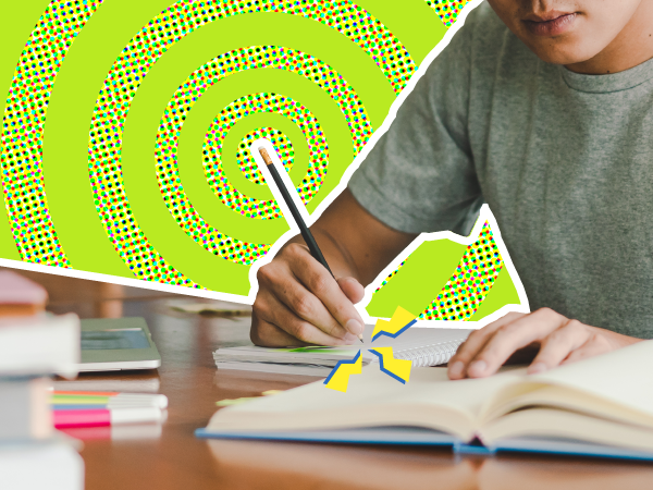 Person writing in notebook with colorful spiral pattern background.