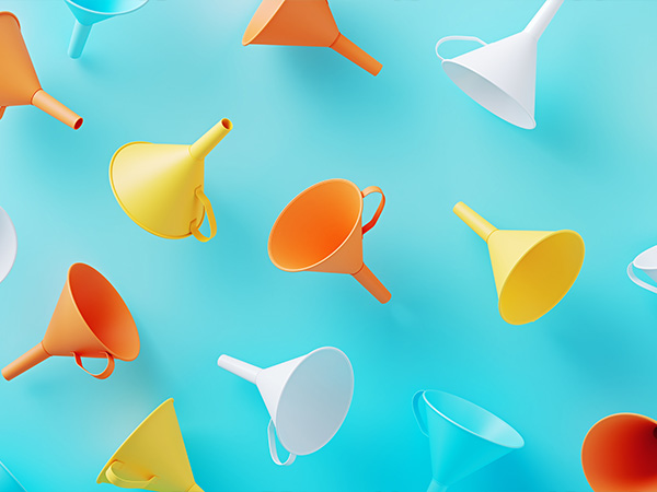 Colorful funnels floating on light blue background.