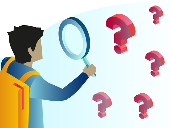 Boy with magnifying glass examining red question marks